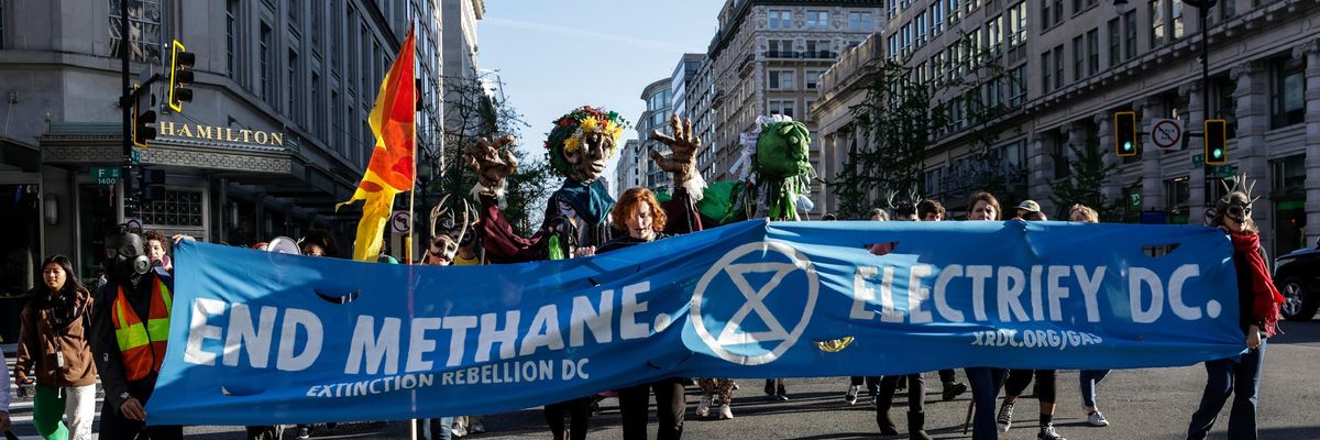 Protesters hold "End Methane" sign at a march in Washington DC