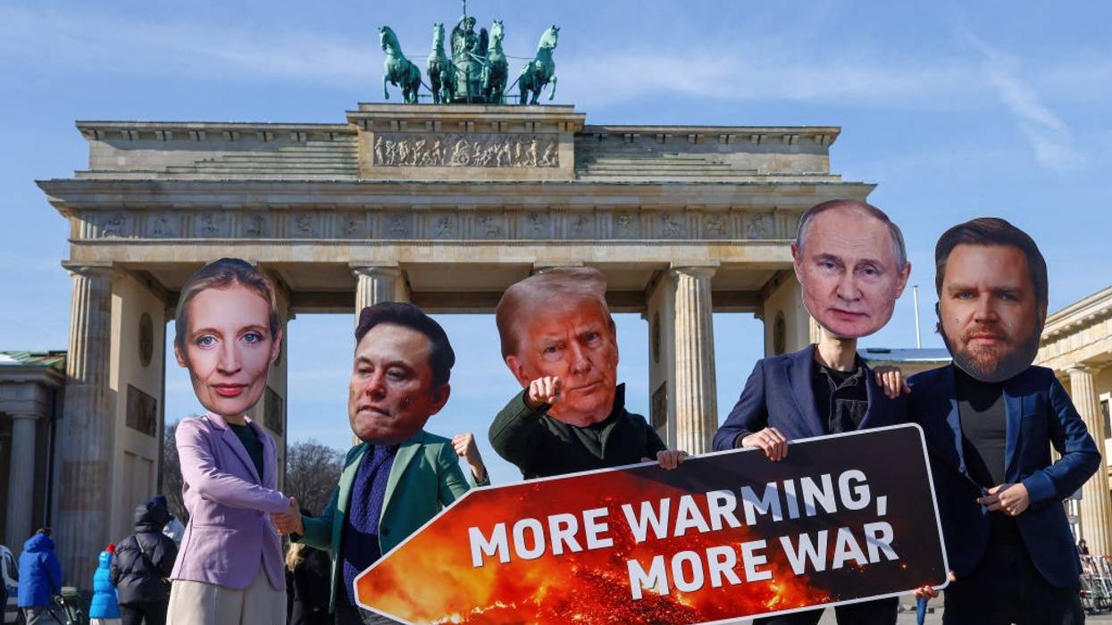Protesters in masks of Alice Weidel, Elon Musk, Donald Trump, Vladimir Putin, and JD Vance in Berlin.