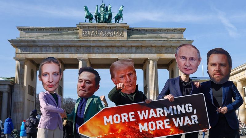 Protesters in masks of Alice Weidel, Elon Musk, Donald Trump, Vladimir Putin, and JD Vance in Berlin.