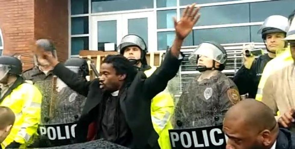 Protesters, including clergy, marched to the Ferguson police department on Monday in the first of a series of planned actions. (Photo: Occupy Chicago/Twitter)