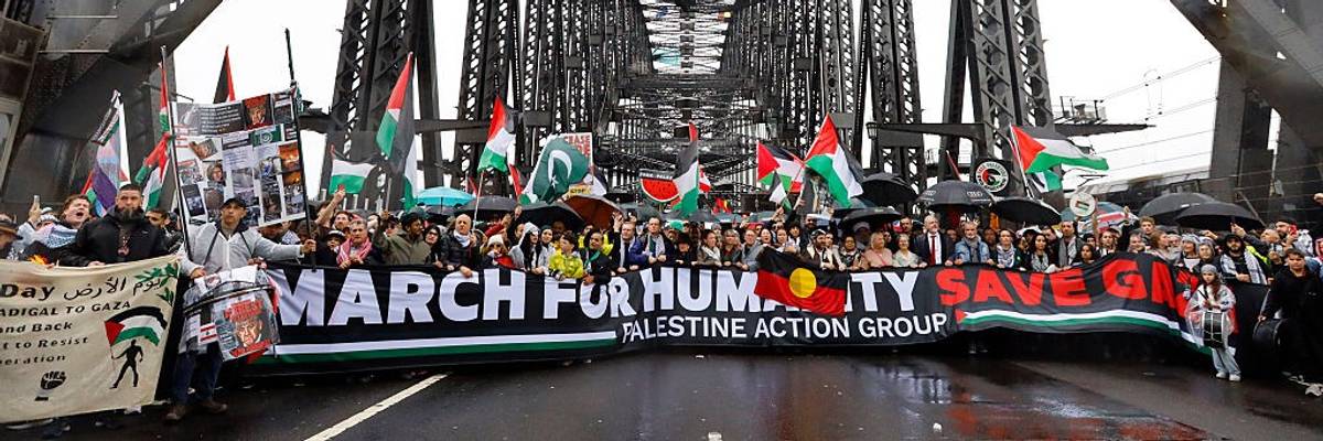 Protesters march across the Sydney Harbour Bridge during the...