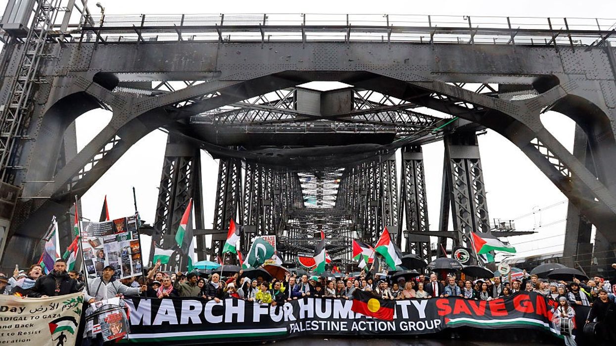 Protesters march across the Sydney Harbour Bridge during the...
