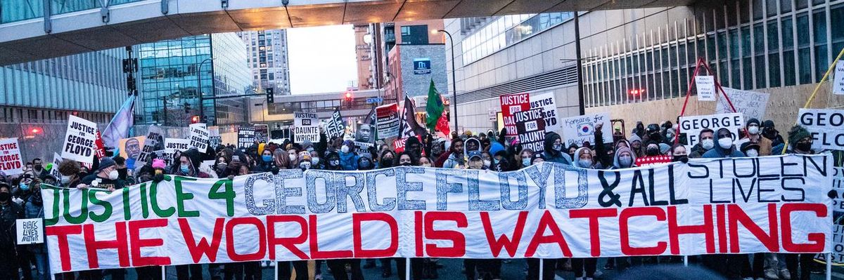 Protesters march around downtown Minneapolis near the courthouse calling for justice for George Floyd after closing arguments in Derek Chauvin's trial ended Monday, April 19, 2021.