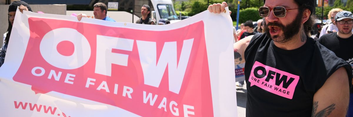 Protesters march during a rally for fair labor practices