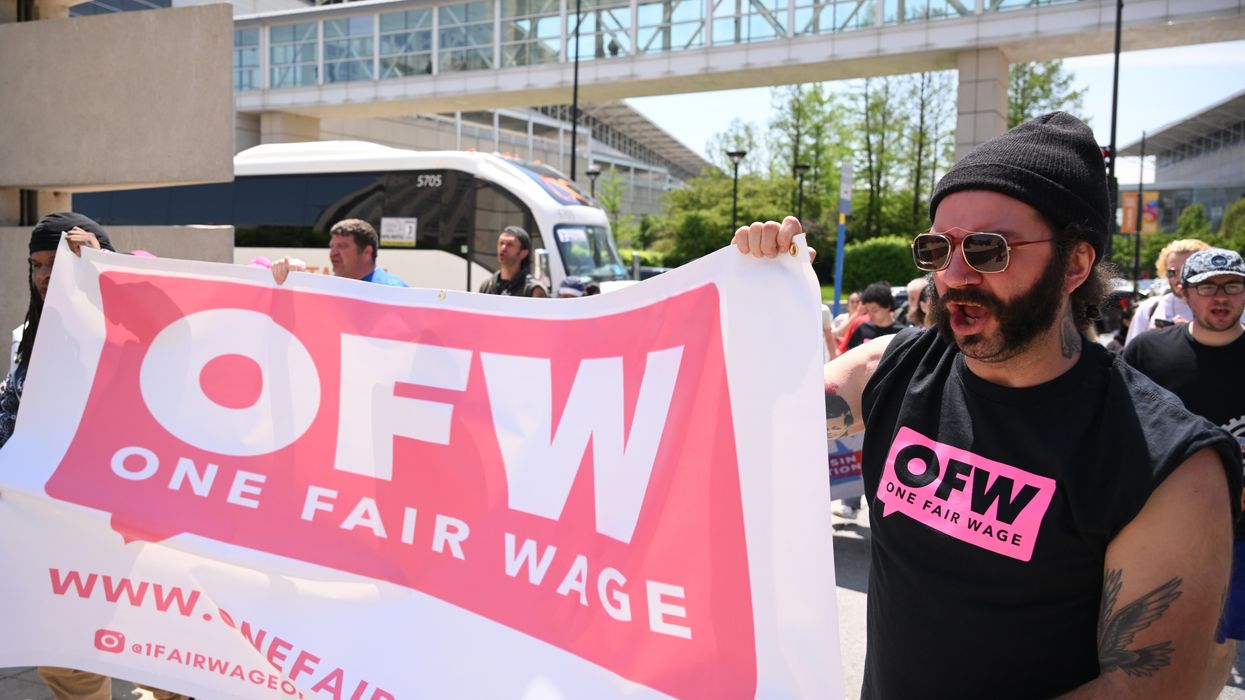 Protesters march during a rally for fair labor practices