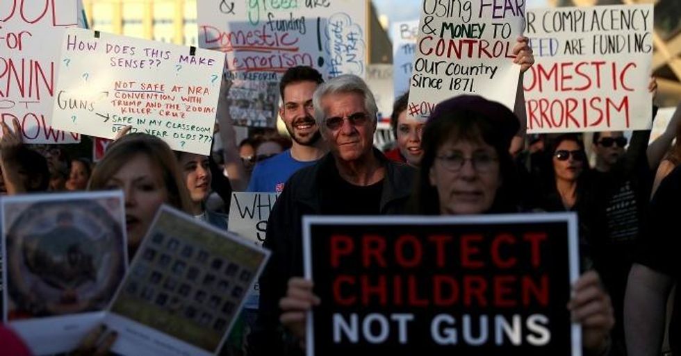 Protesters march to the NRA Annual Meeting & Exhibits at the Kay Bailey Hutchison Convention Center on May 4, 2018 in Dallas, Texas. (Photo: Justin Sullivan/Getty Images)Protesters march to the NRA Annual Meeting & Exhibits at the Kay Bailey Hutchison Convention Center on May 4, 2018 in Dallas, Texas. (Photo: Justin Sullivan/Getty Images)