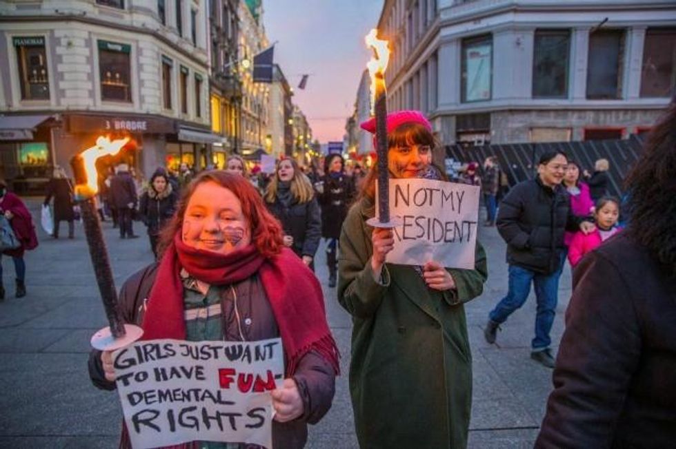 Protesters marched in Oslo, Norway, as the sun rose. (Photo: Reuters)