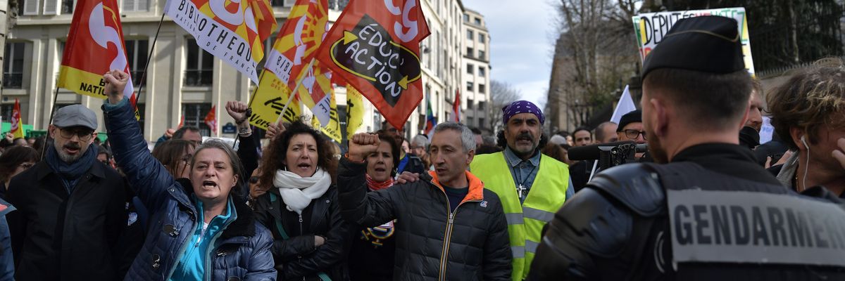 Protesters participate in a demonstration against the French government's plan to raise the retirement age in front of the National Assembly in Paris, on March 16, 2023.