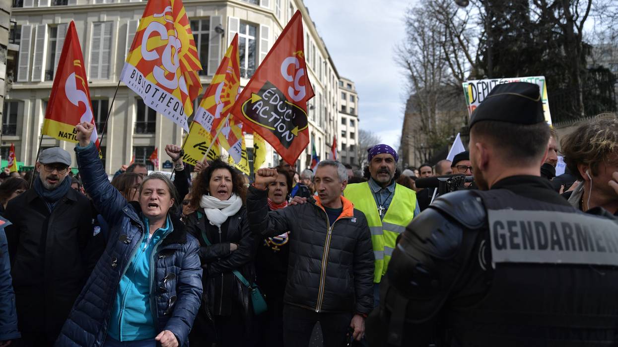 Protesters participate in a demonstration against the French government's plan to raise the retirement age in front of the National Assembly in Paris, on March 16, 2023.