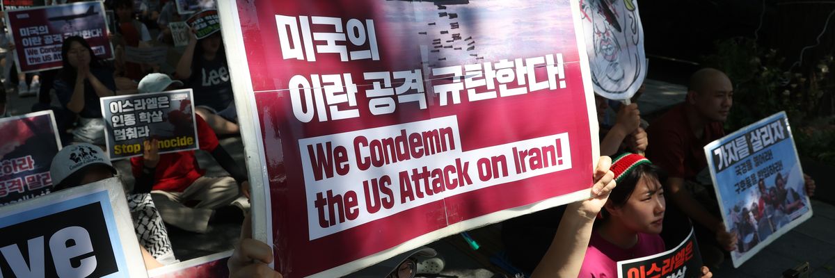 Protesters participate in a rally condemning the U.S. and Israeli strikes on Iran