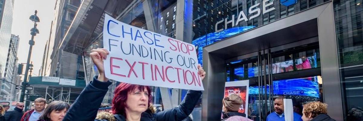 Protesters picket outside a Chase Bank branch in November 2019.