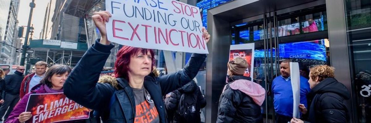 Protesters picket outside a Chase Bank branch in November 2019.