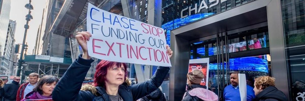 Protesters picket outside a Chase Bank branch in November 2019. 