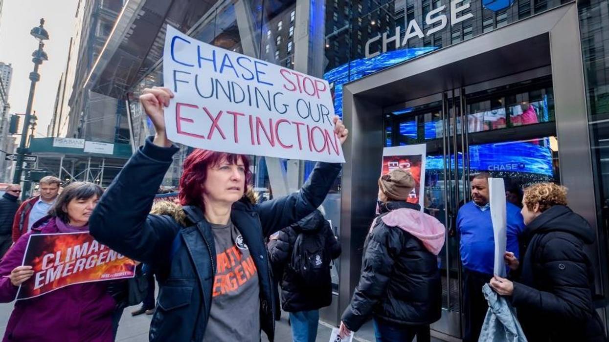Protesters picket outside a Chase Bank branch in November 2019.