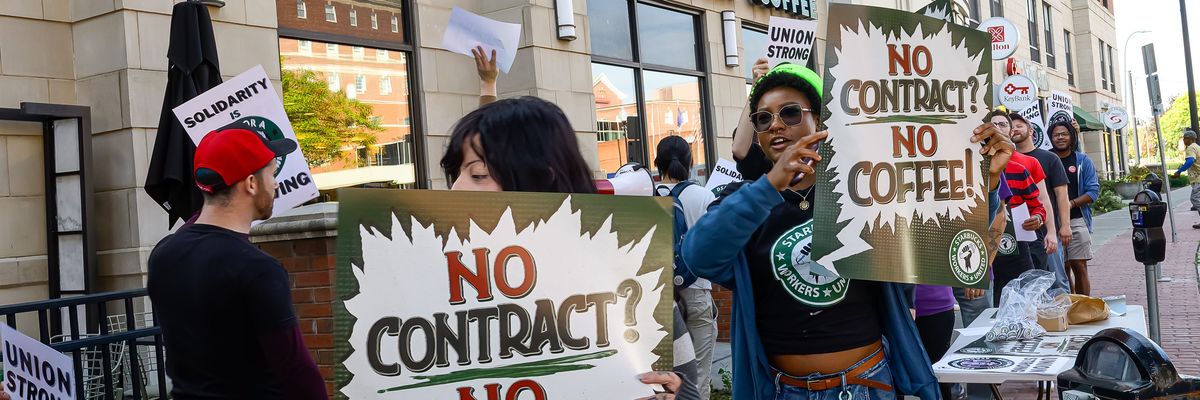 Protesters rally outside the Starbucks...