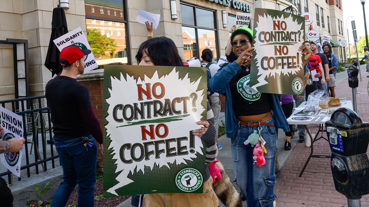 Protesters rally outside the Starbucks...