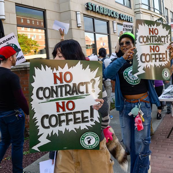 Protesters rally outside the Starbucks...