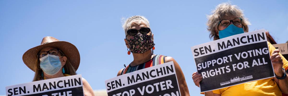 Protesters sound off against Manching filibuster reform opposition.