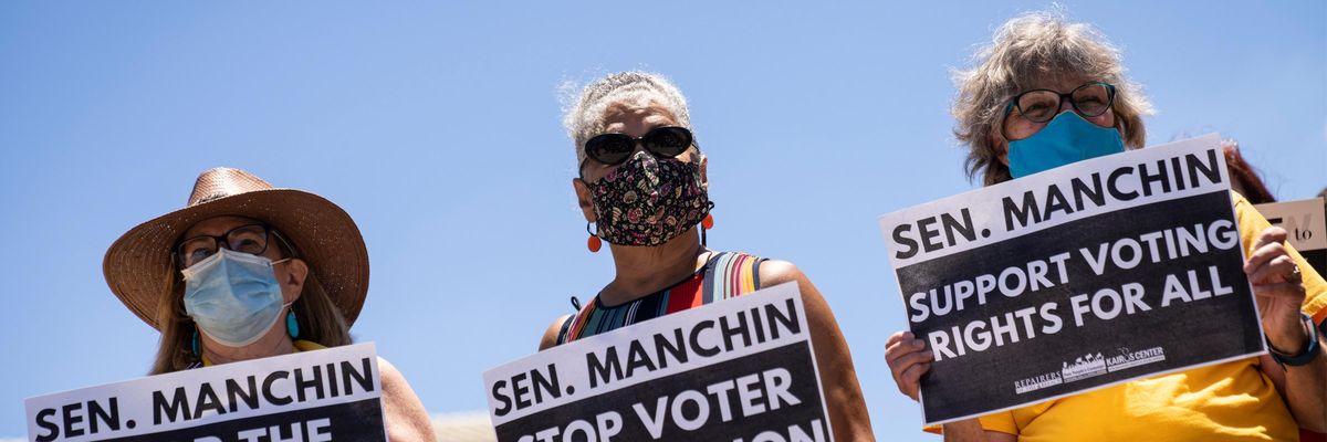 Protesters sound off against Manching filibuster reform opposition.