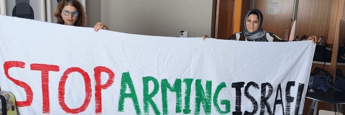 Protesters unfurl banner at DNC.