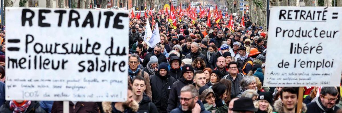 Protesters wave flags and banners during a rally in France