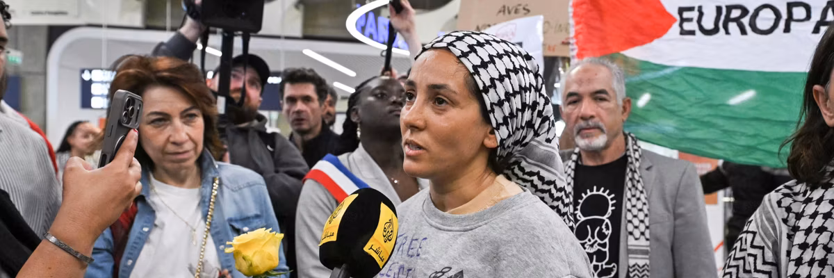 Protesters welcome returned Global Sumud Flotilla activists at Paris airport