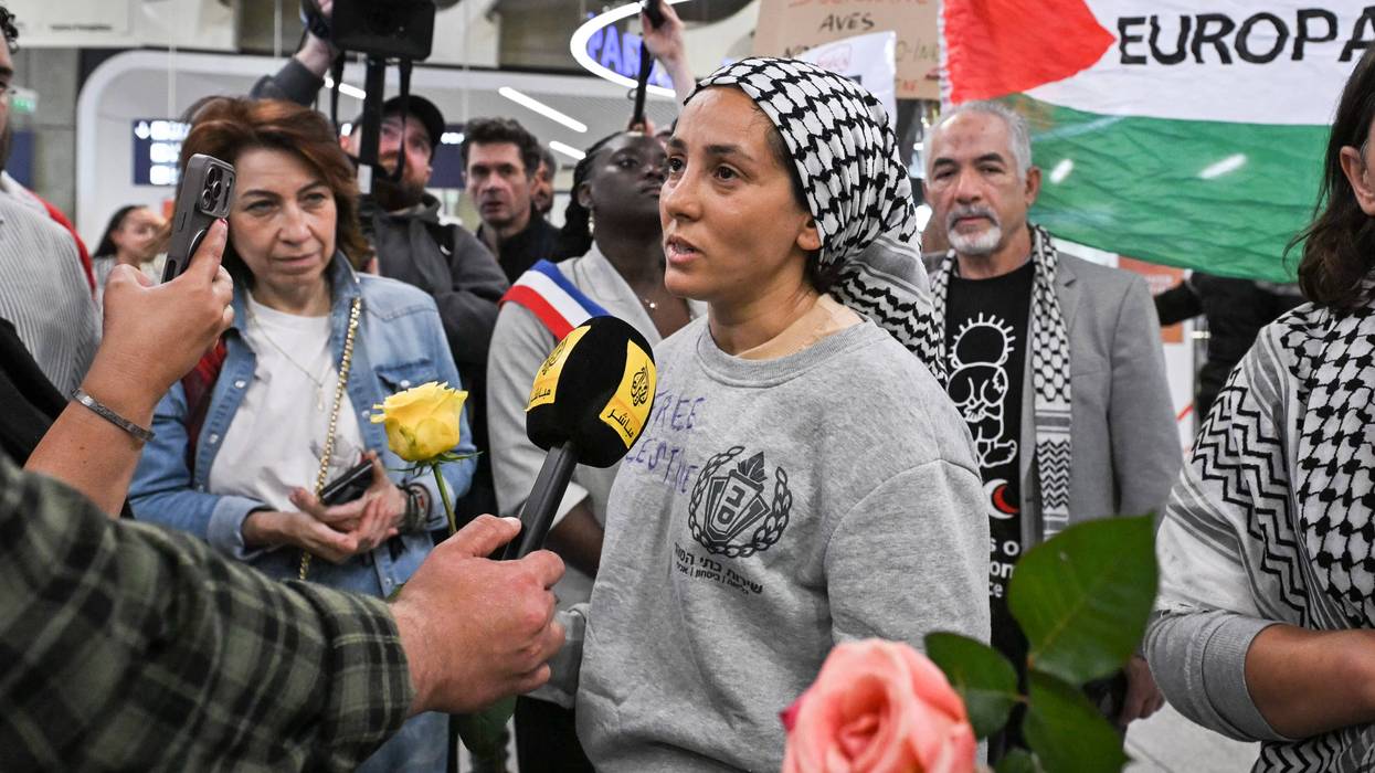 Protesters welcome returned Global Sumud Flotilla activists at Paris airport
