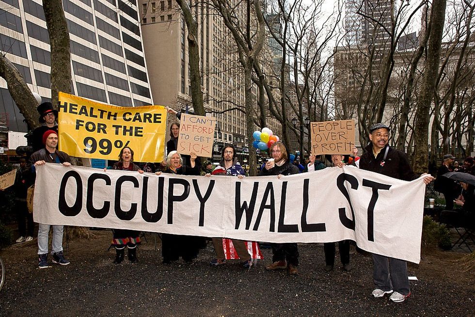 Protesters with an Occupy Wall Street banner.