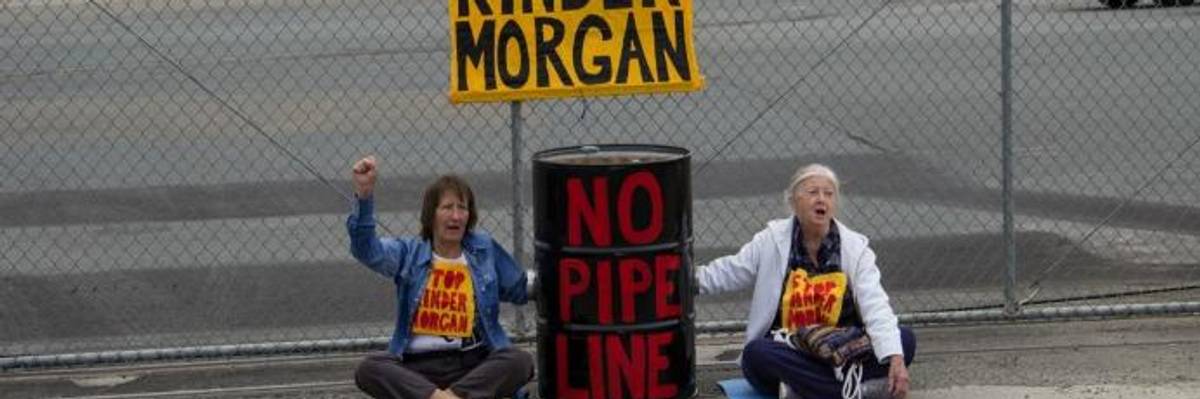 Protestors block the gates of the Kinder Morgan Richmond Terminal in California