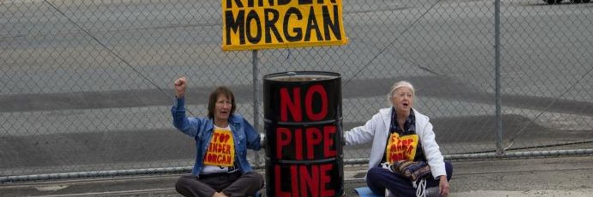 Protestors block the gates of the Kinder Morgan Richmond Terminal in California