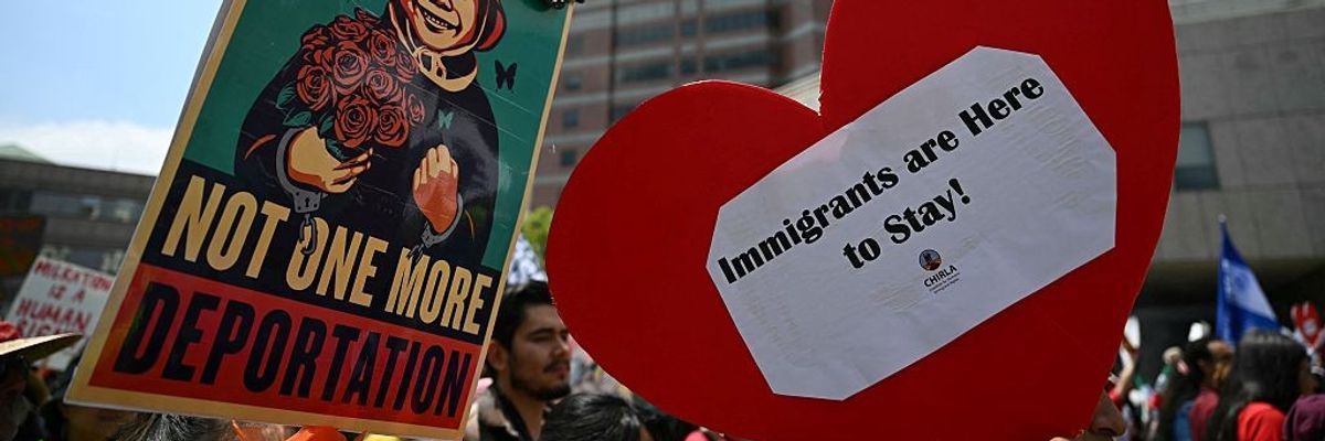 Protestors call for an end to deportations outside the Metropolitan Detention Center in Los Angeles