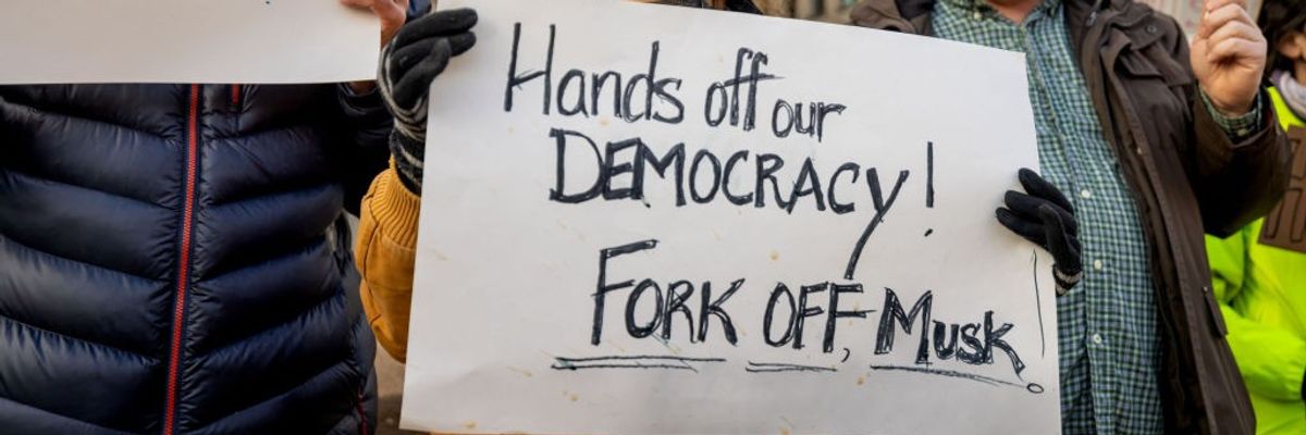 Protestors gather outside of the United States Office of...