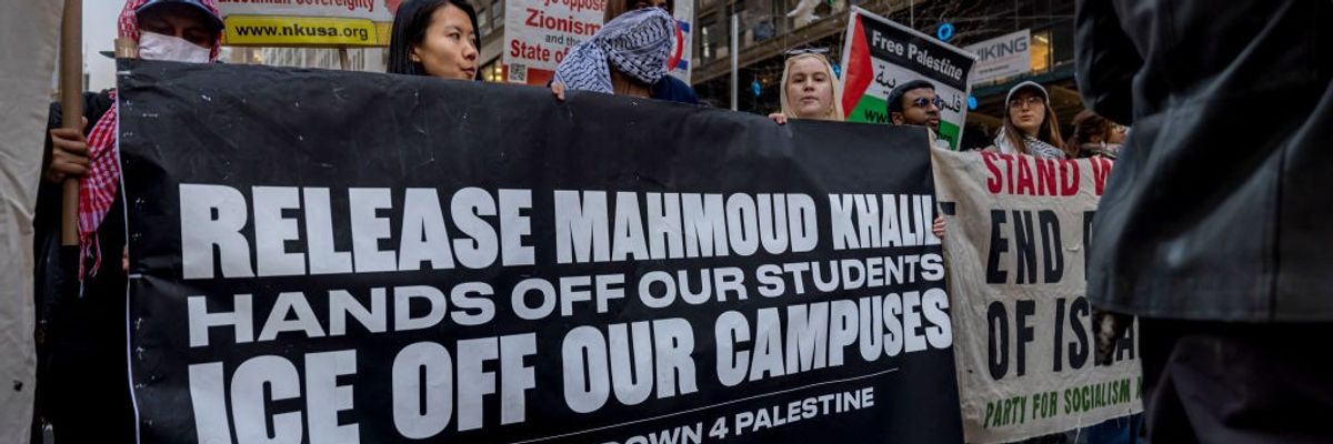 Protestors hold a banner that reads: "Release Mahmoud Khalil"