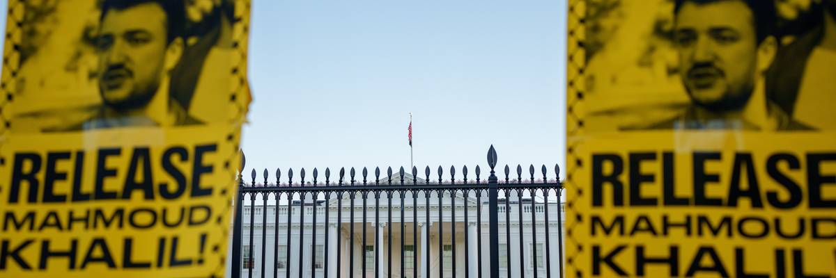 Protestors hold signs calling for the release of former Columbia University student Mahmoud Khalil