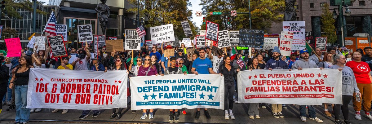 Protestors rally against the Trump administration's anti-immigrant crackdown in Charlotte