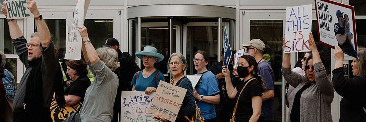 Protestors stand outside the U.S. District Court for the District of Maryland