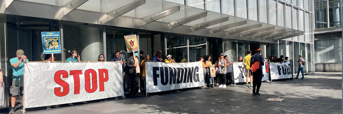 protestors with banners at Citi headquarters