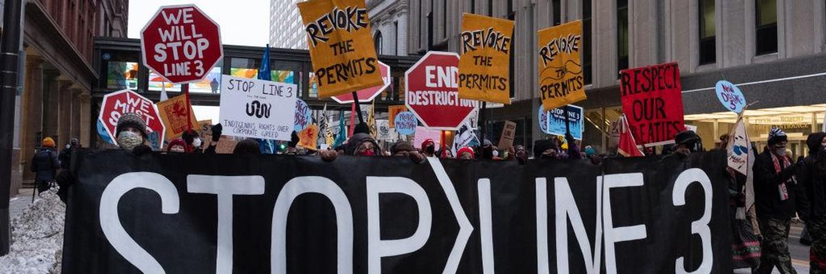 Protests march through downtown St. Paul, MN with a Stop Line 3 banner on January 29, 2021. (Photo: Tim Evans/NurPhoto via Getty Images)