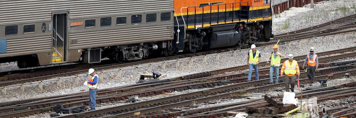 Rail workers service tracks in Chicago