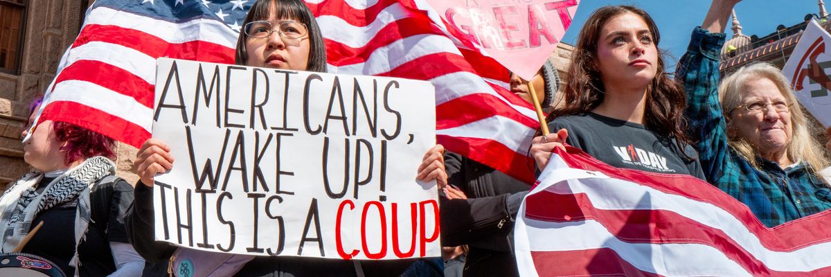 Rally goers protest against U.S. President Donald Trump