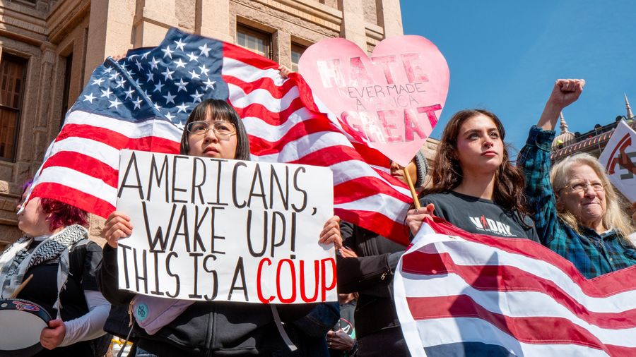 Rally goers protest against U.S. President Donald Trump