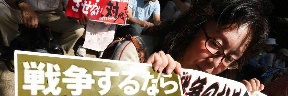 Tens of Thousands Surround Japan's Parliament Denouncing 'War Legislation'