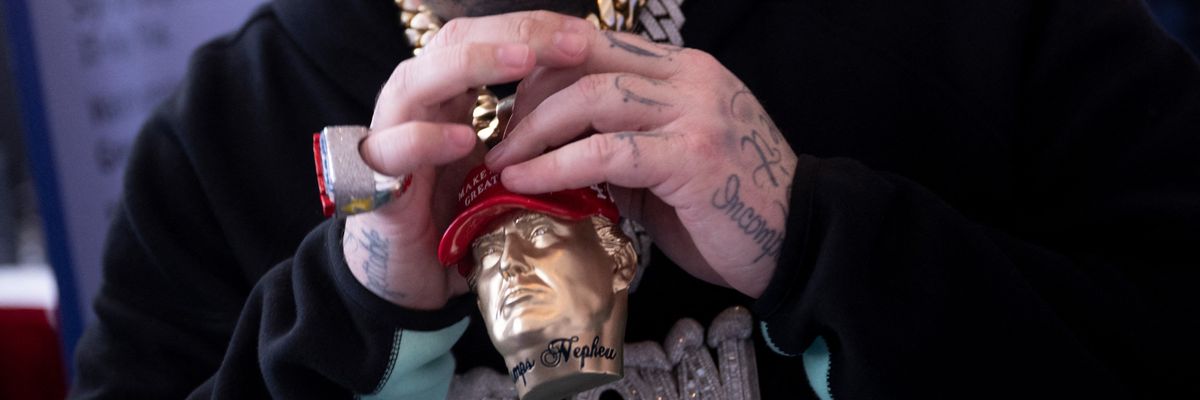 Rapper  Forgiato Blow shows off his Trump jewelry this weekend at CPAC 2024.