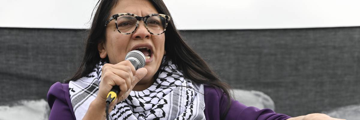 Rashida Tlaib speaks wearing a keffiyeh