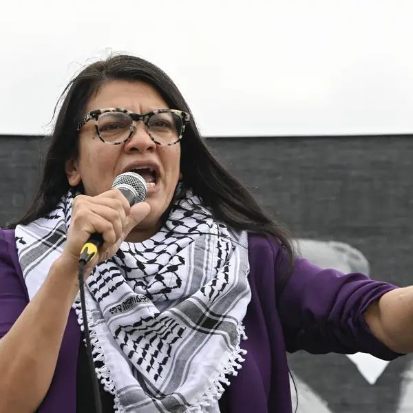 Rashida Tlaib speaks wearing a keffiyeh