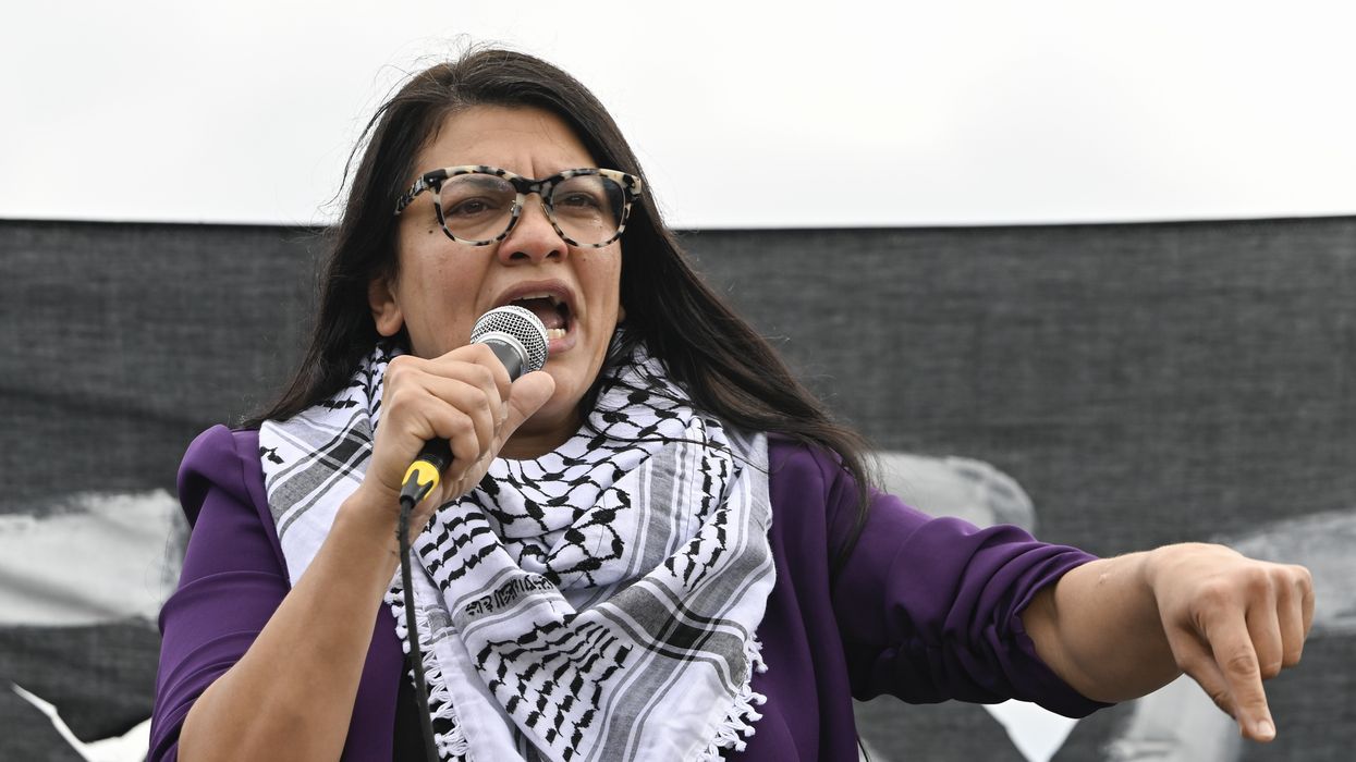Rashida Tlaib speaks while wearing a keffiyeh