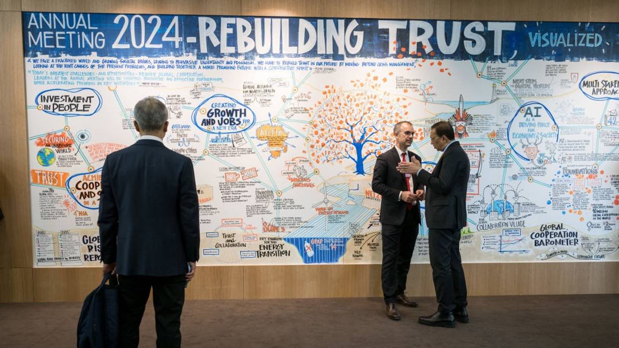 'Rebuilding Trust' sign at Davos in 2024