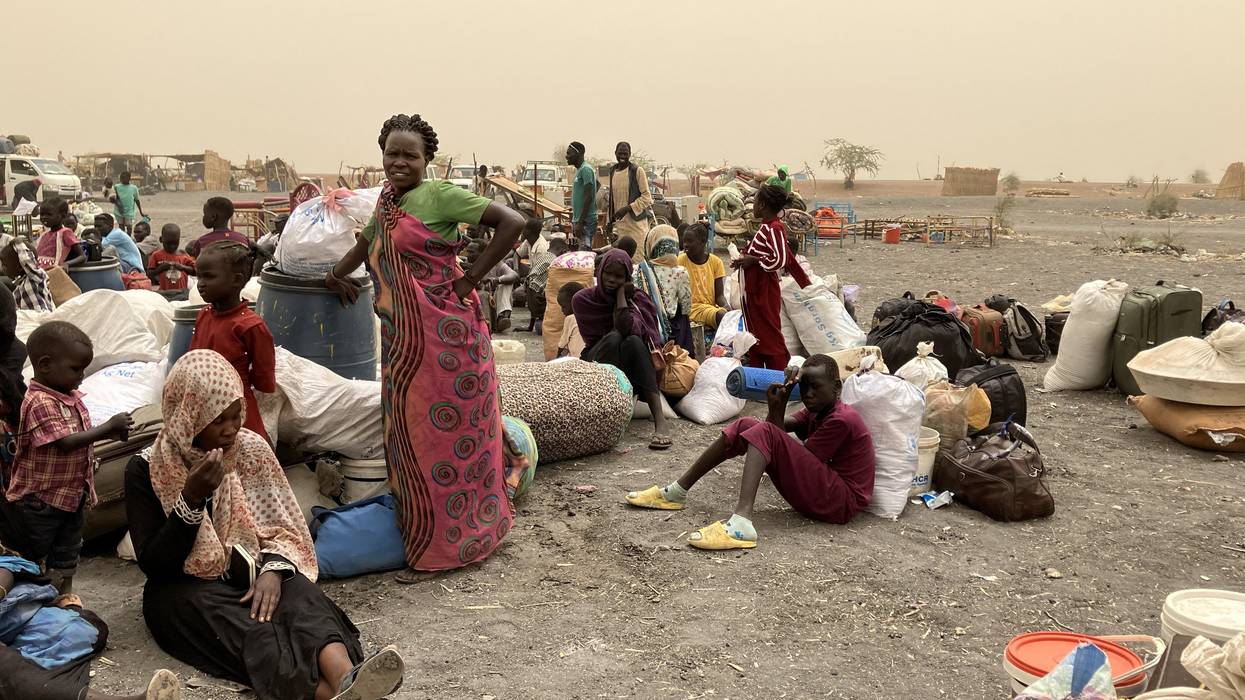 Refugees from Sudan wait to be transported to the transit camp in the town of Renk