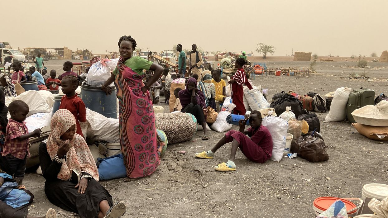 Refugees from Sudan wait to be transported to the transit camp in the town of Renk