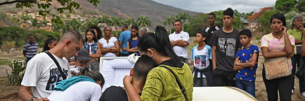 Relatives and friends of 11-year-old Erick Altuve, a Venezuelan boy who died of cancer while waiting to receive a bone marrow transplant, attend his funeral at a cemetery in Caracas, on May 30, 2019. (Photo: Marvin Recinos/AFP via Getty Images)
